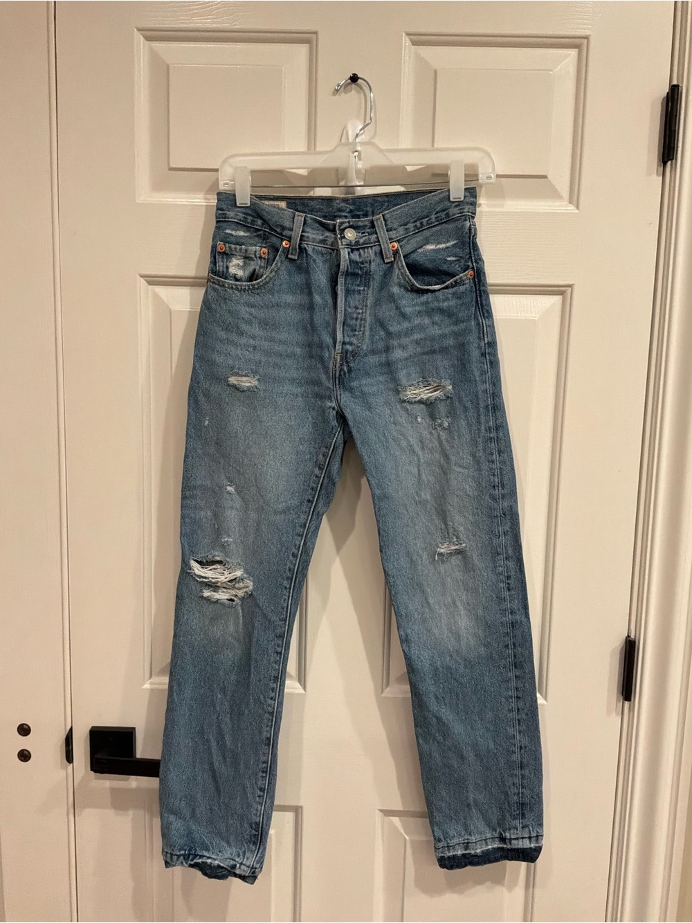 Levi's Women's Straight Jeans in Light Blue with Distressed Details